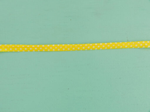 Passepoil à pois jaune 10 mm gros plan